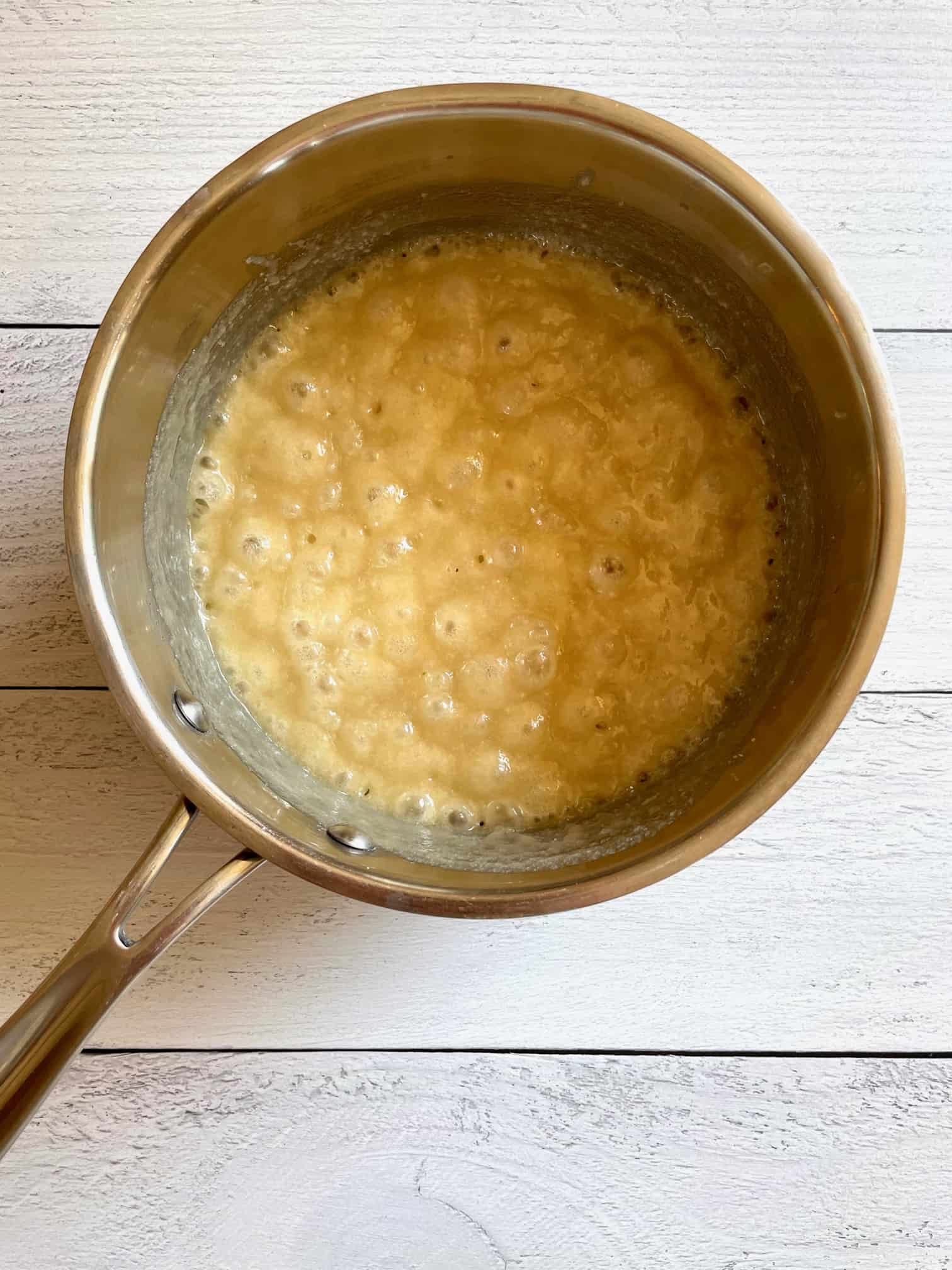 Butter, milk and sugar melted in a saucepan and at a rolling boil.