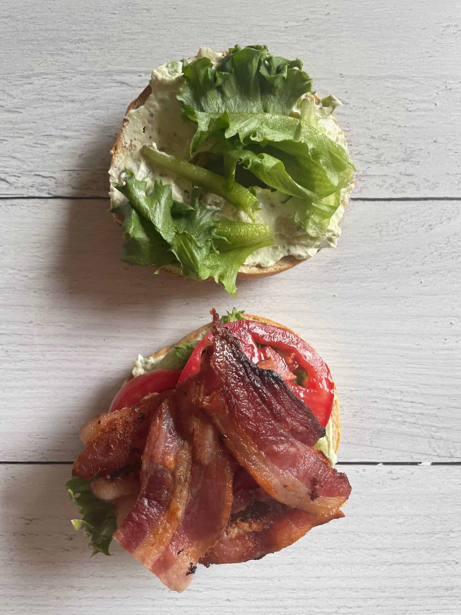 Bagel with bacon, lettuce, tomato and cream cheese spread.