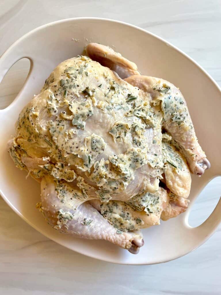 Roasted chicken with garlic herb butter slathered all over the chicken