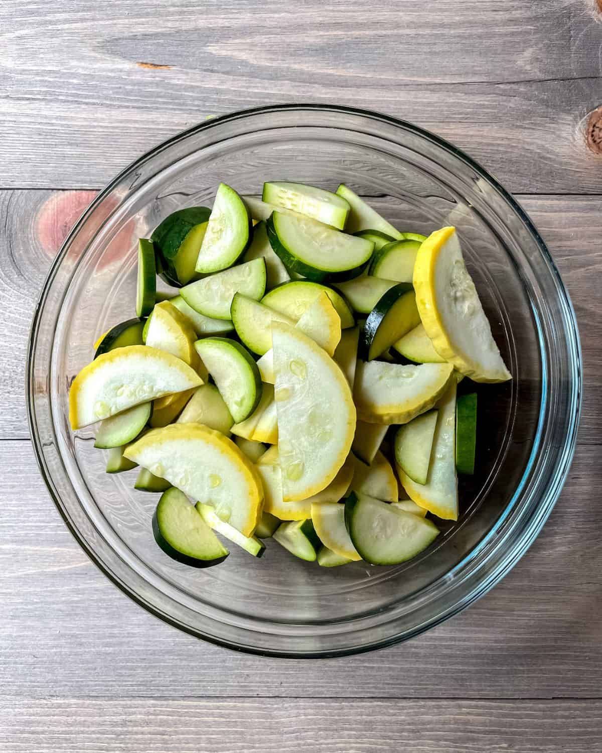 Zucchini and yellow squash in a round bowl.