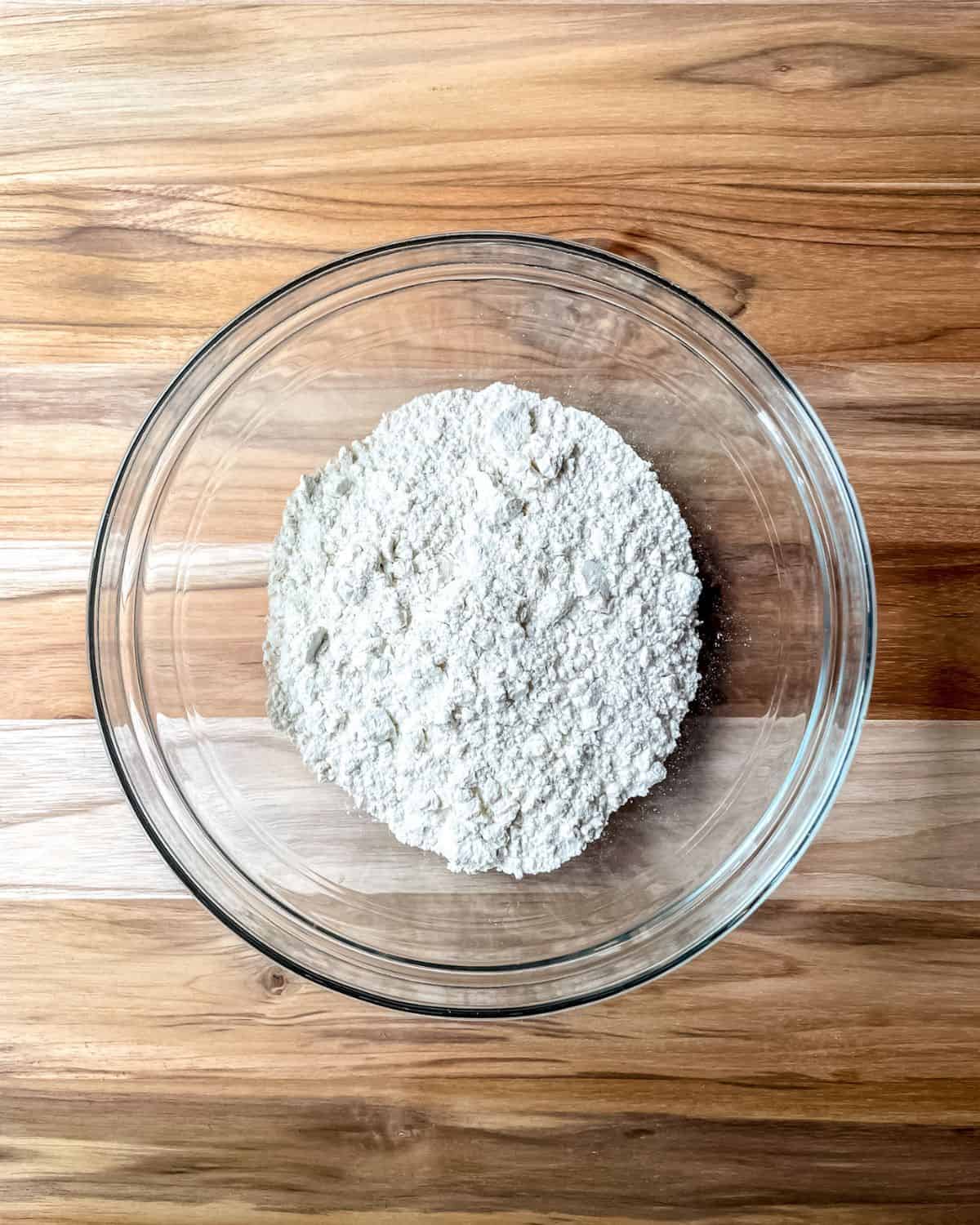 Flour in a glass bowl.