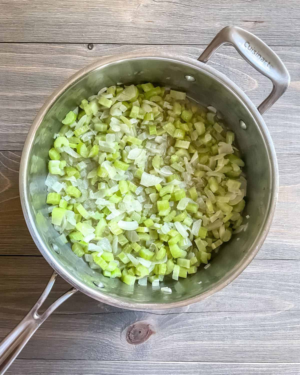 Celery, onion and butter in a large, stainless steel sauté pan.