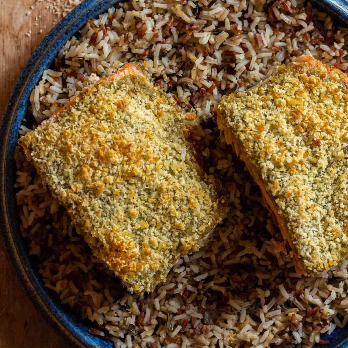 Pesto crusted salmon with panko bread crumbs, over a bed of rice.