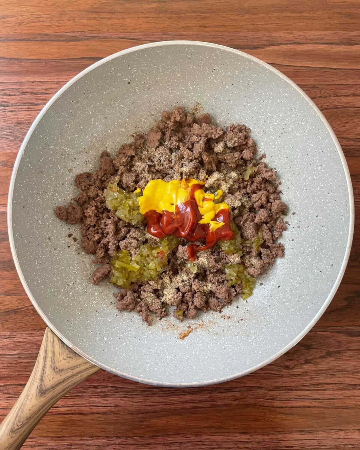 Cooked ground beef mixed with ketchup, mustard, relish, and seasonings.