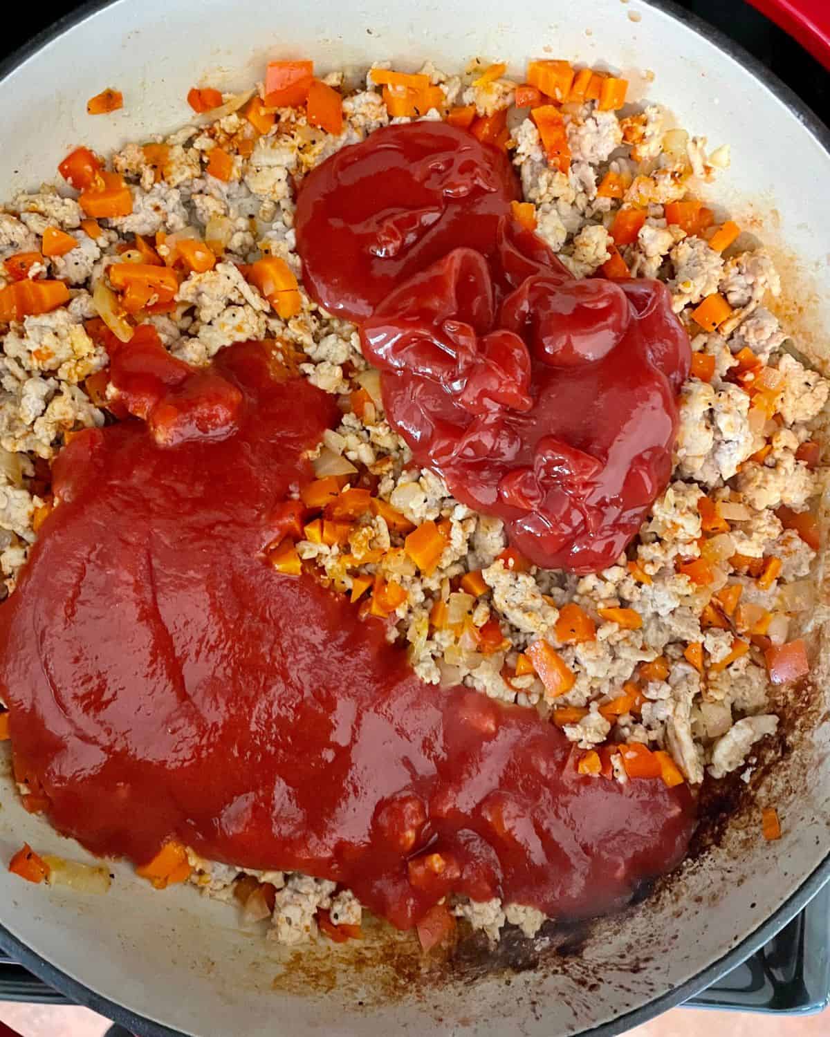Tomato sauce, ketchup, Worcestershire sauce, and apple cider vinegar added to the pan.