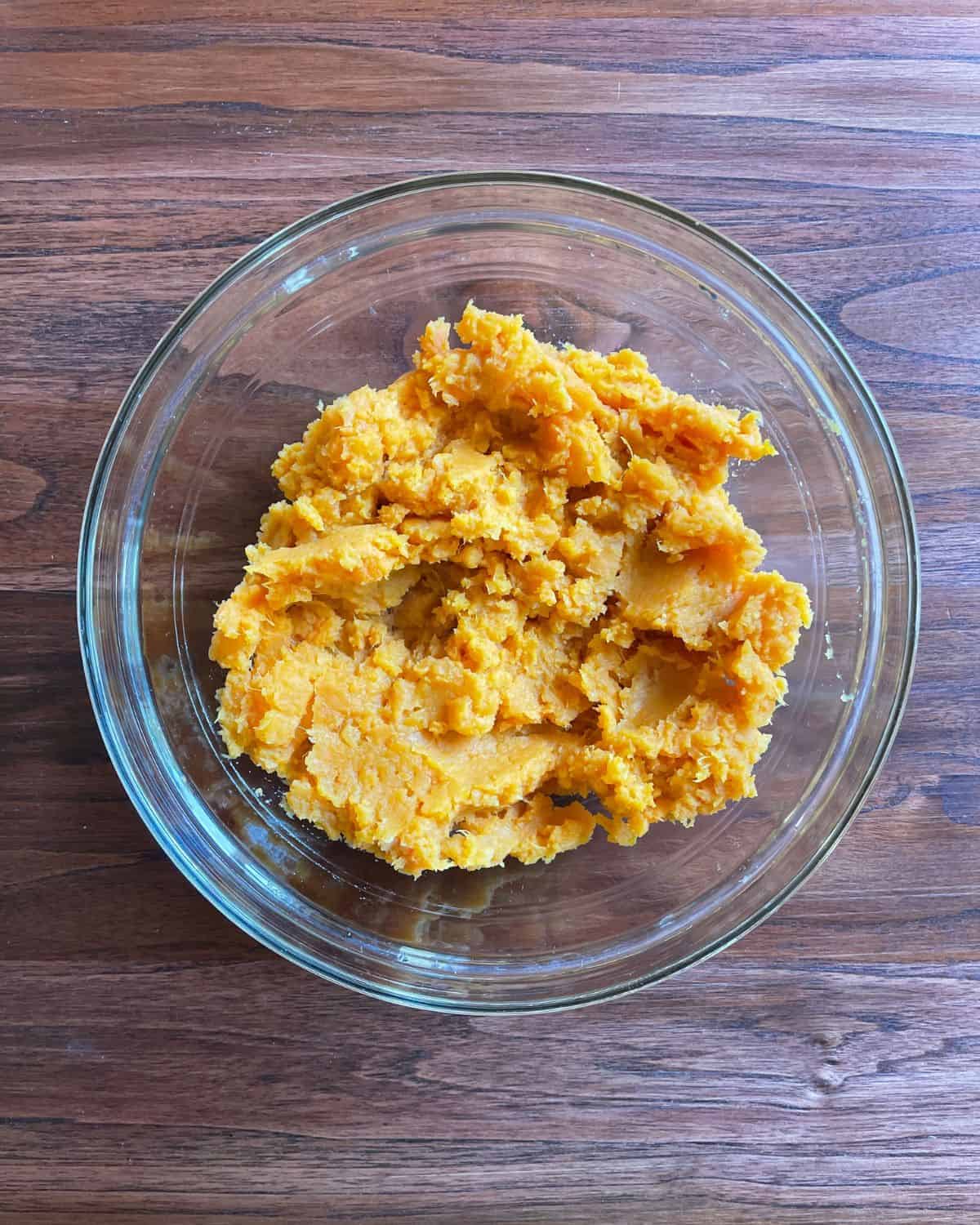 Mashed sweet potatoes in a bowl.