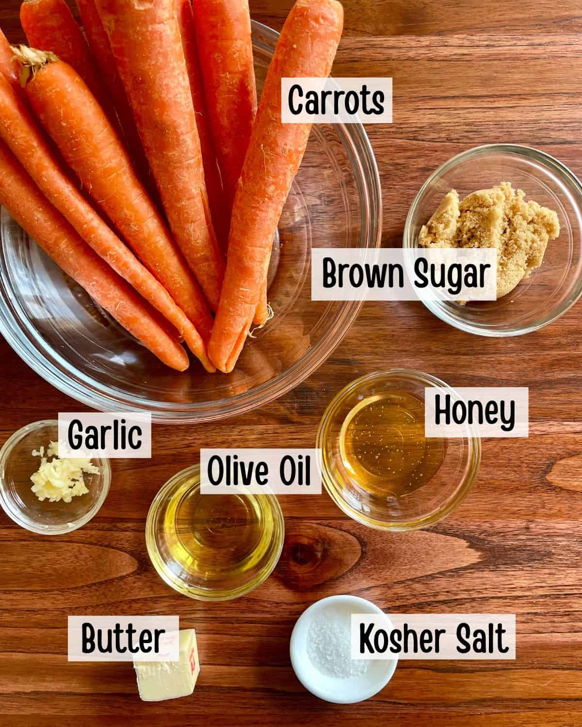 Ingredients needed to make baked carrots glazed with brown sugar and honey.