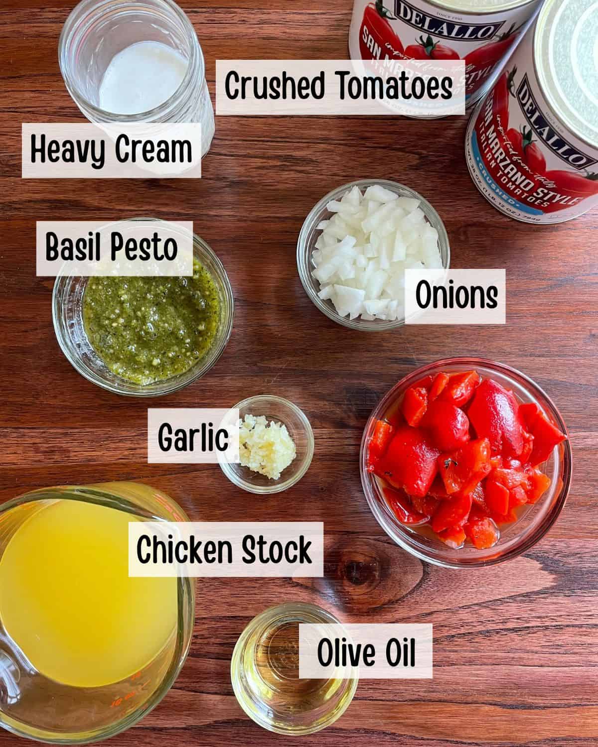 Ingredients needed to make roasted red pepper and tomato soup.