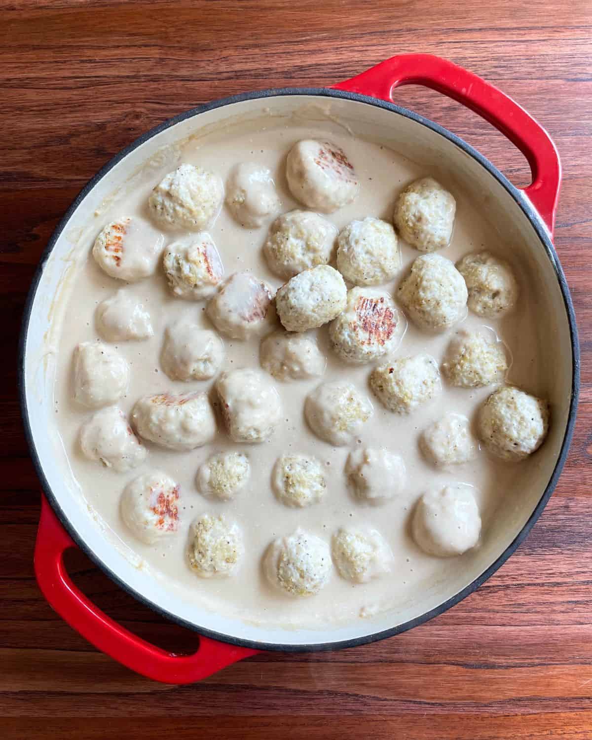 Finished chicken Swedish meatballs in a skillet.
