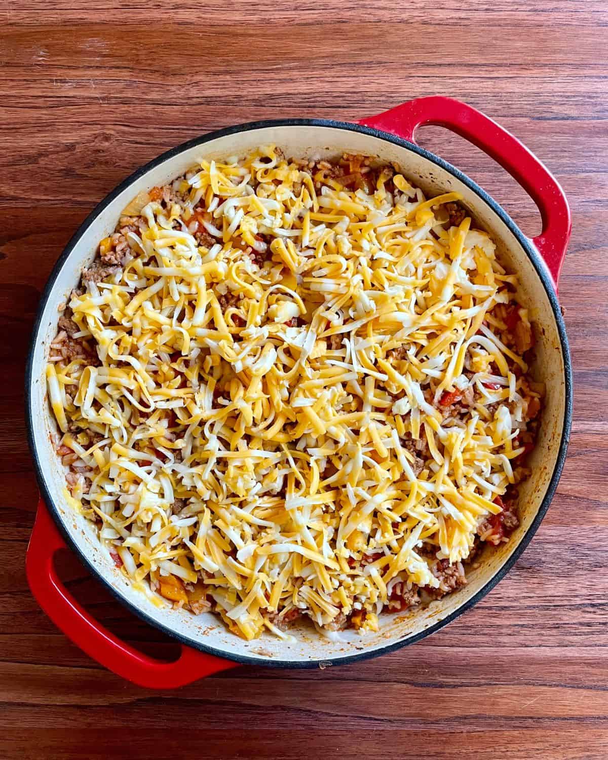 Shredded Colby jack cheese spread over the skillet stuffed pepper recipe.