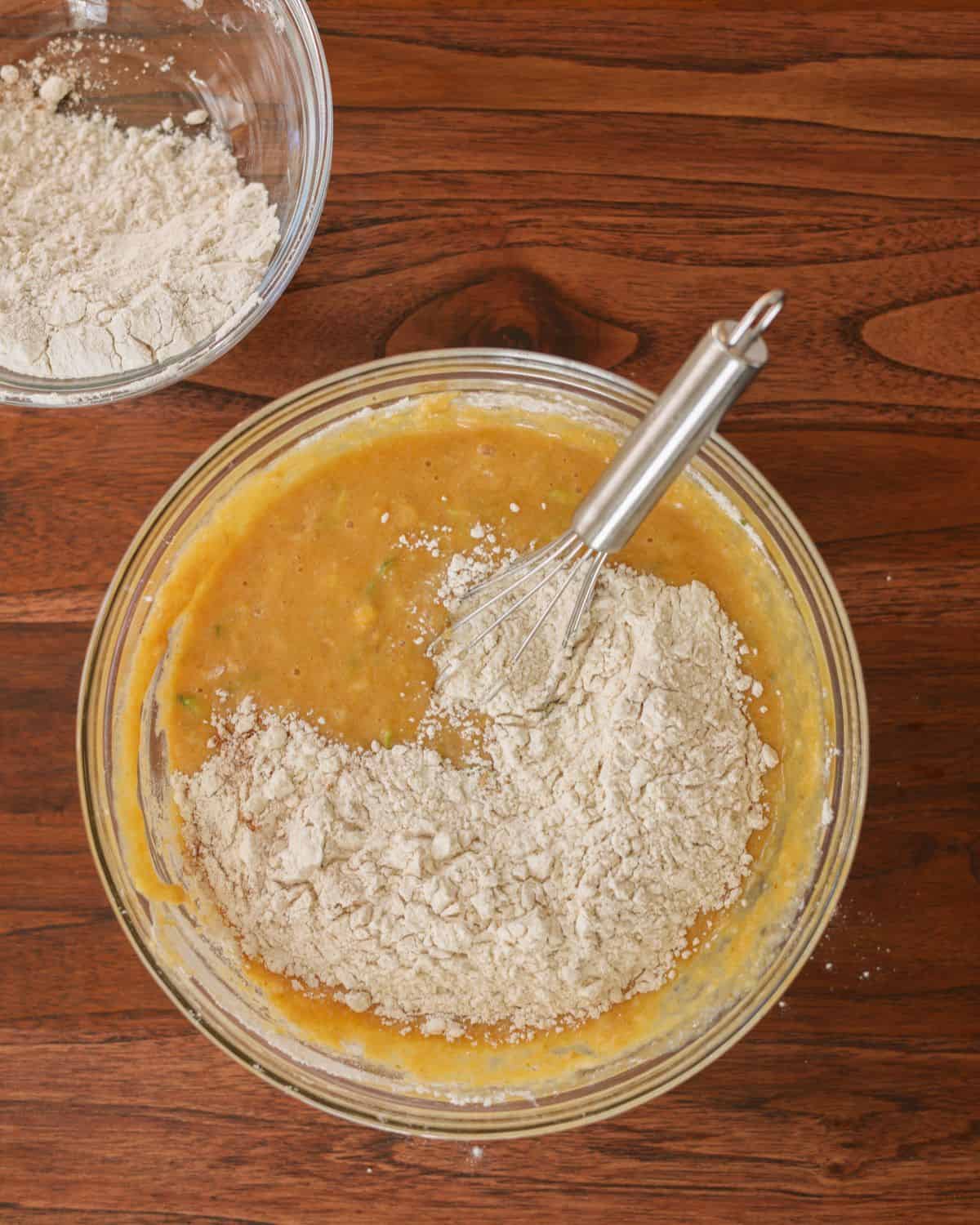 The bowl of wet ingredients starting to get combined with the dry ingredients.