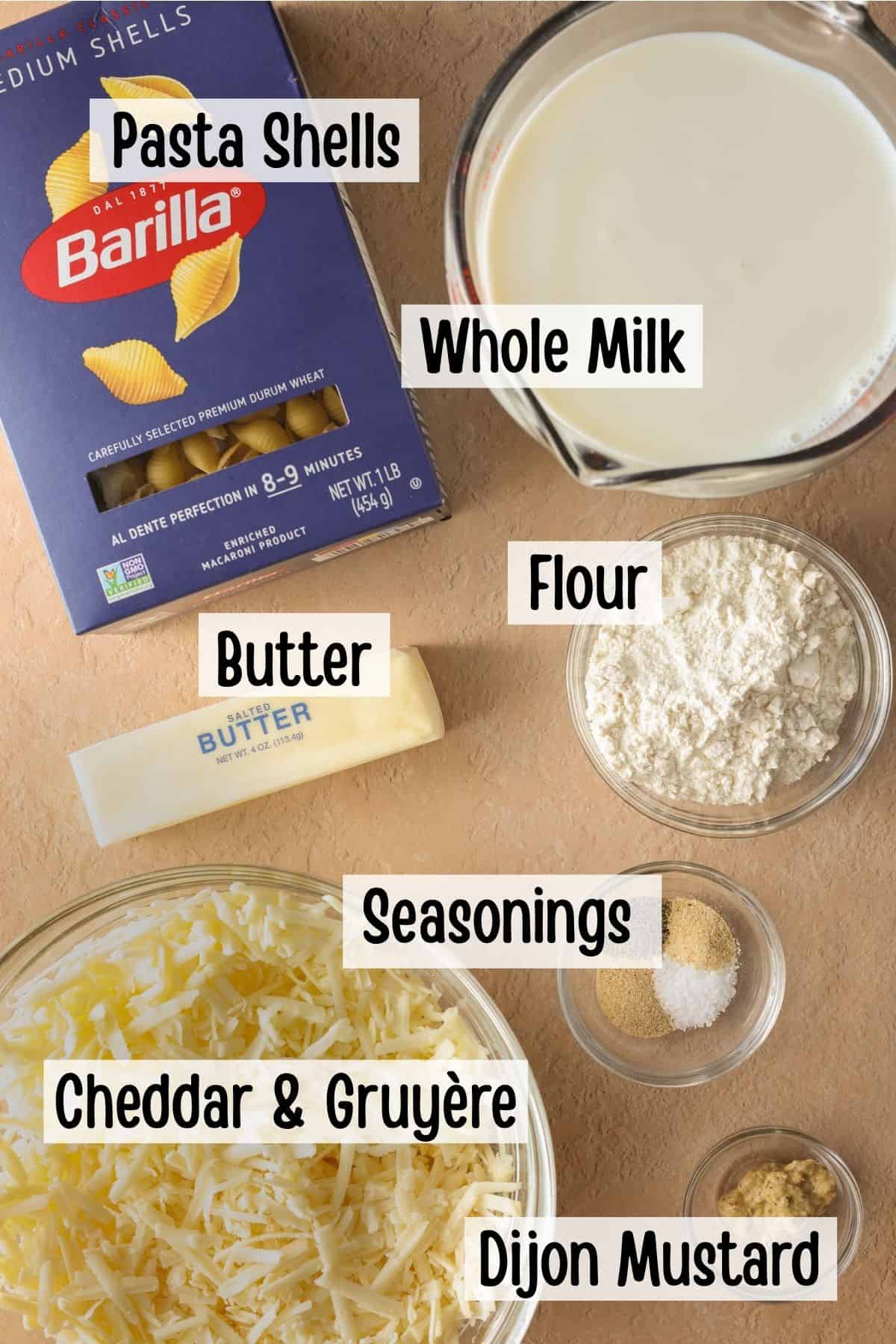 Ingredients needed to make mac and cheese in a Dutch oven.
