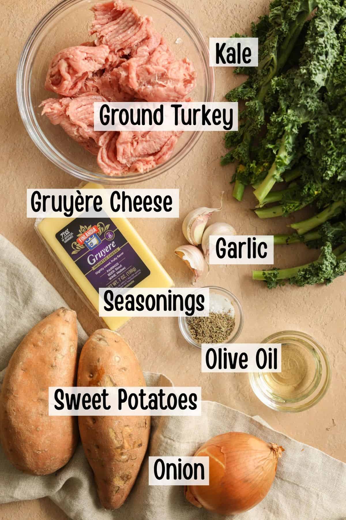 Ingredients needed to make a skillet dinner with ground turkey, sweet potatoes, and kale.