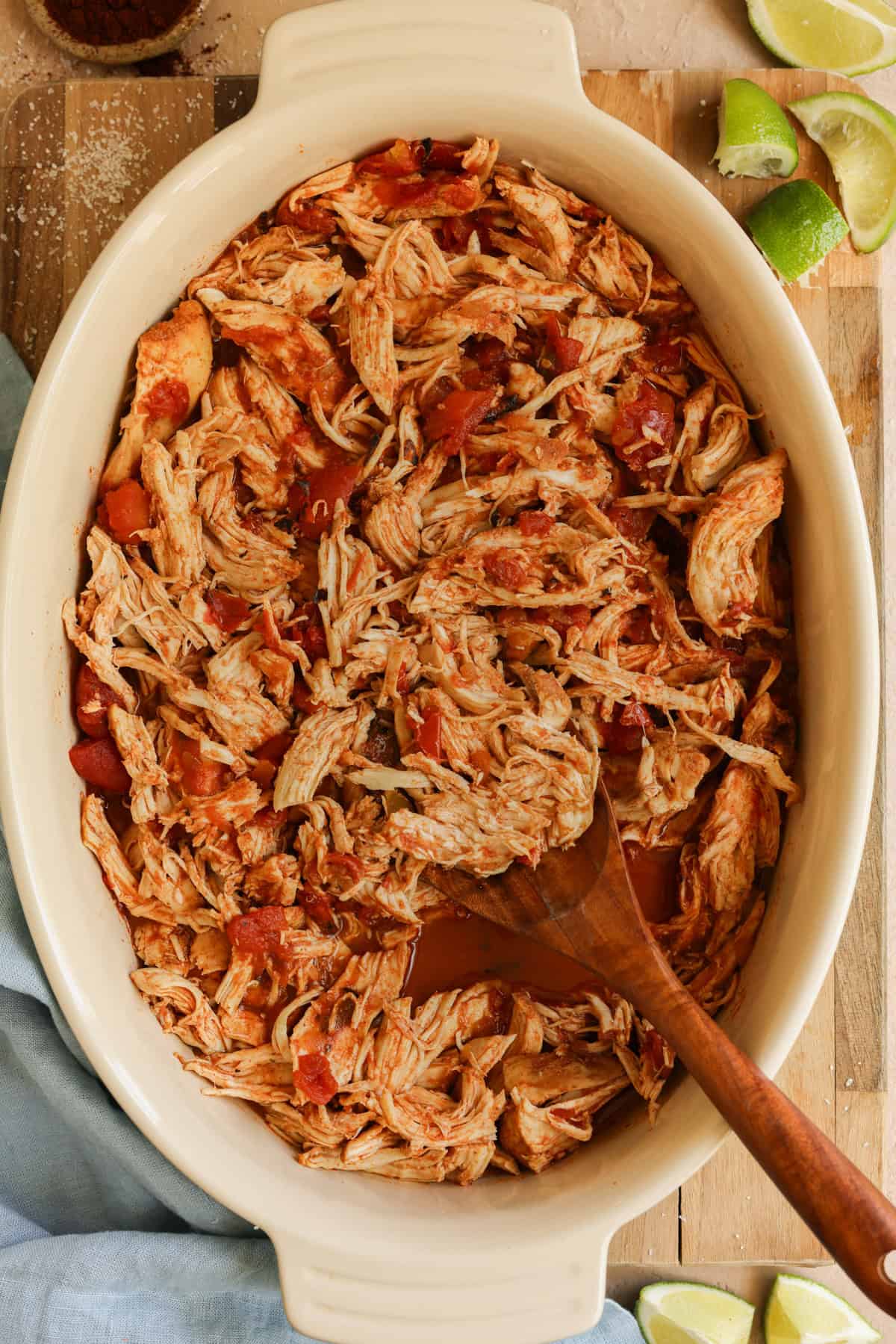 Slow cooker shredded Mexican chicken in a round serving dish.