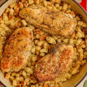 Baked chicken and stuffing in a skillet.