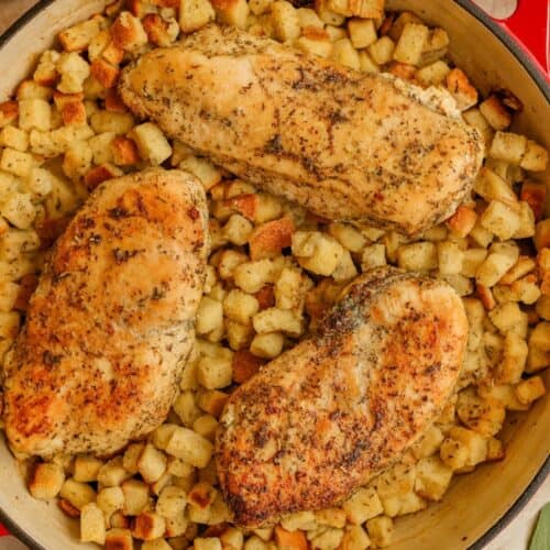 Baked chicken and stuffing in a skillet.