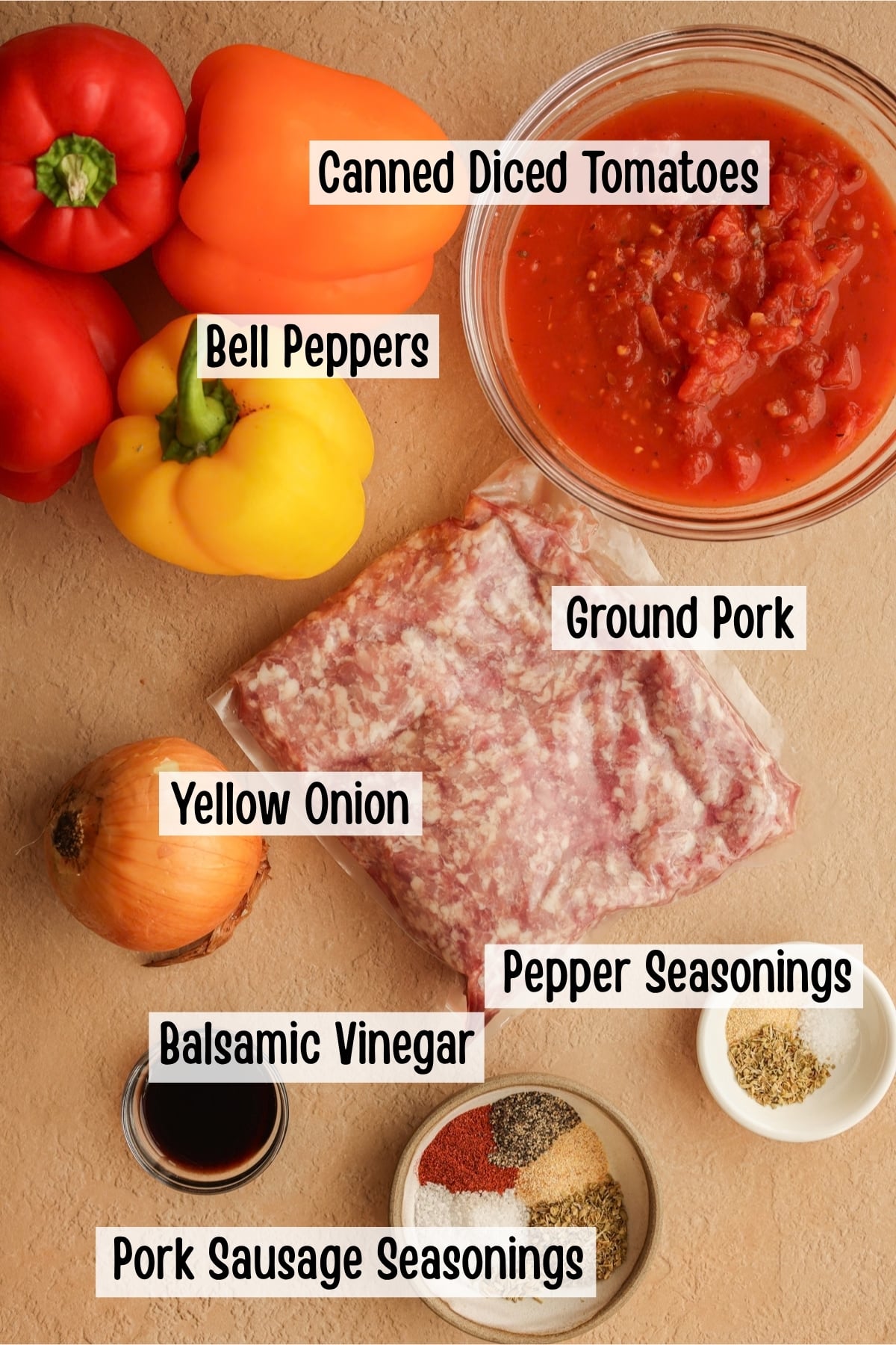 Ingredients needed to make a sausage and peppers skillet dinner with homemade ground pork sausage.