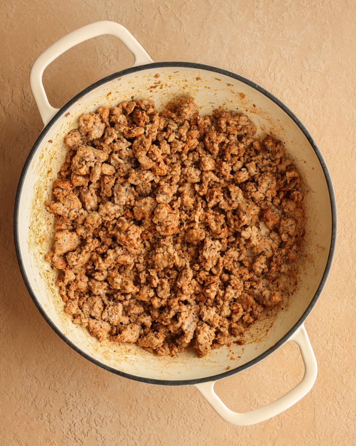 Ground pork cooked in a skillet and seasoned with pork sausage seasonings.
