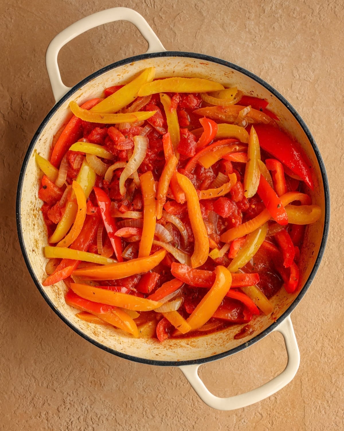 Cooked peppers and onions mixed with balsamic vinegar and canned diced tomatoes.