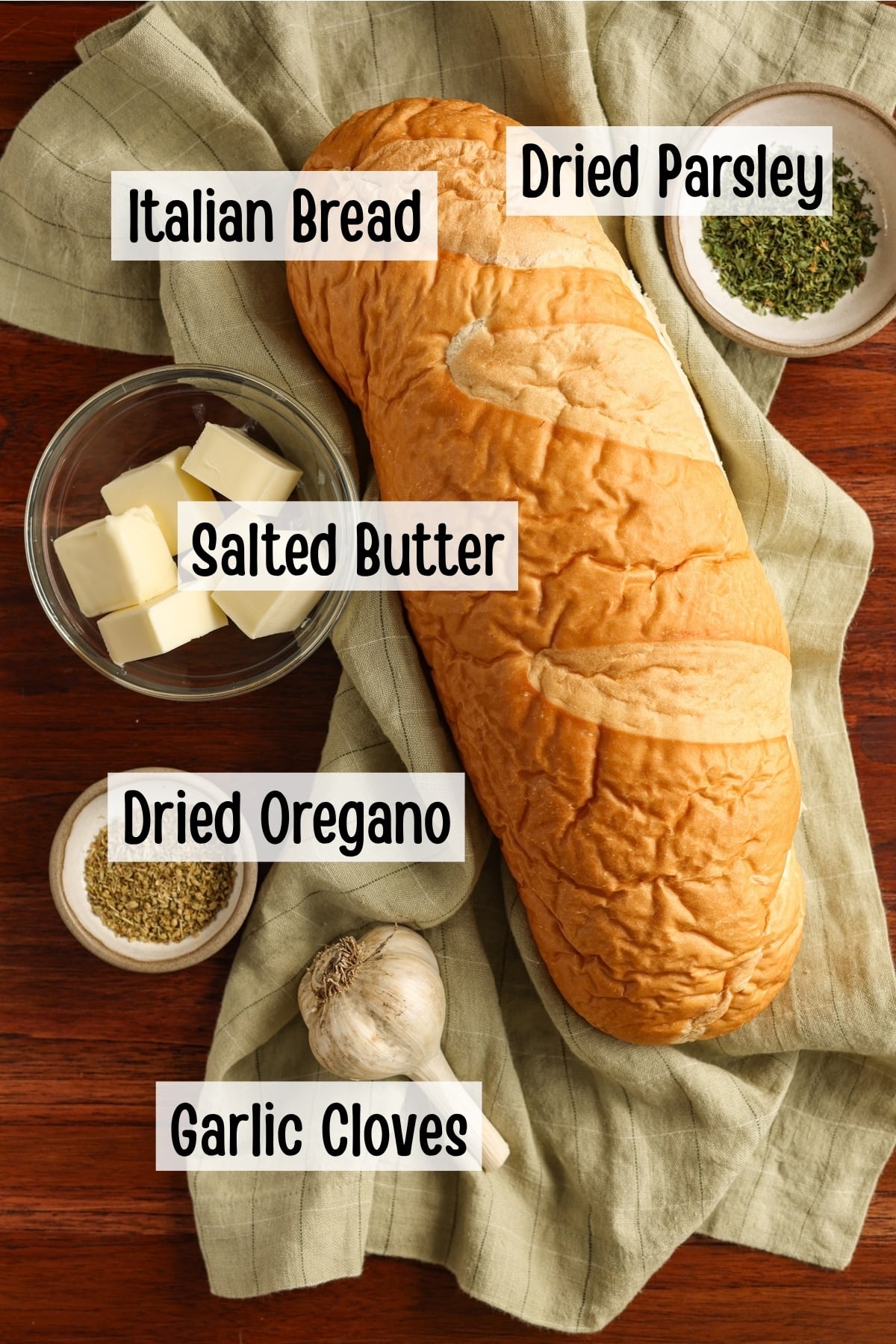 Ingredients needed to make buttery garlic bread.